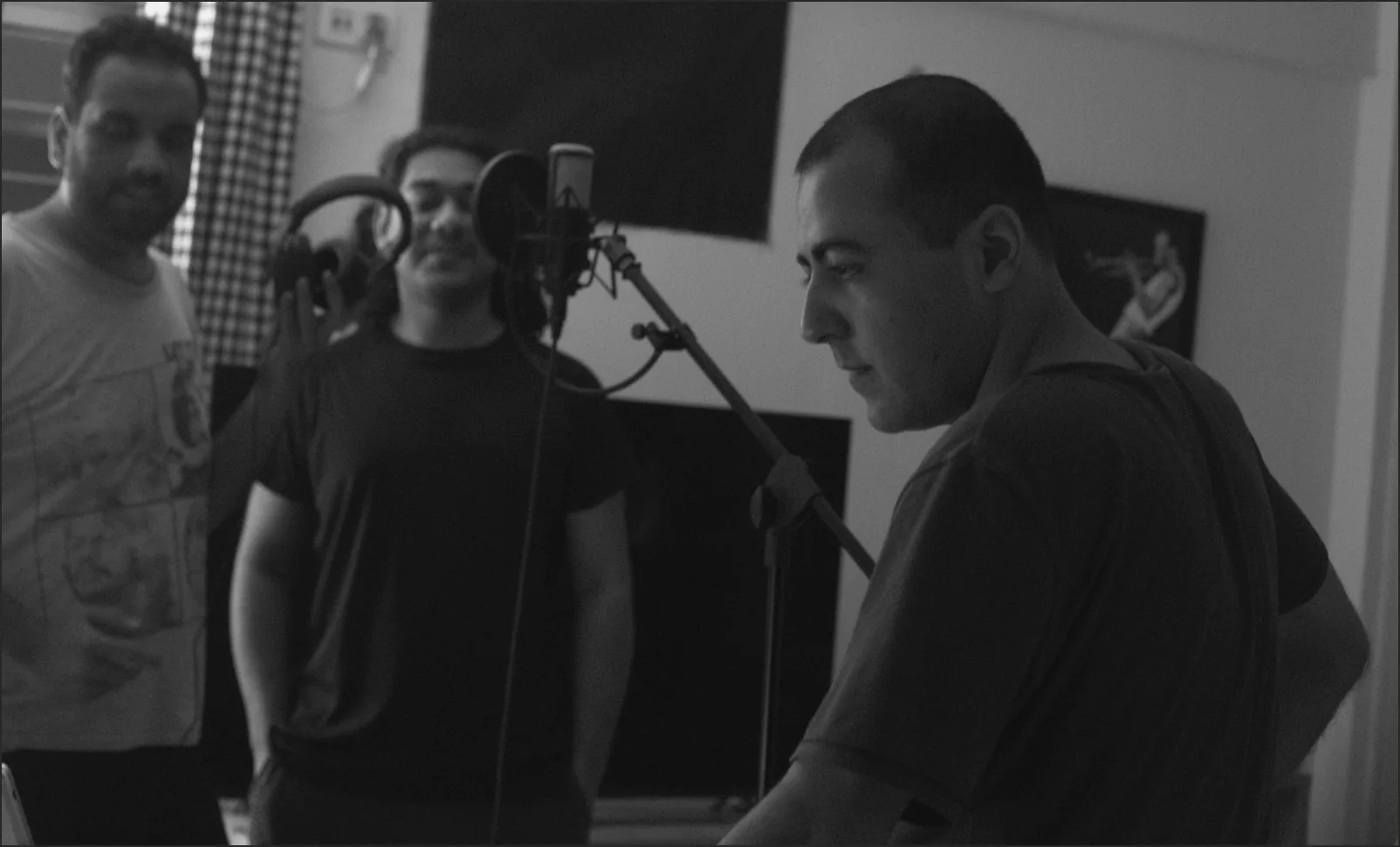 A recording session in progress inside a music studio.